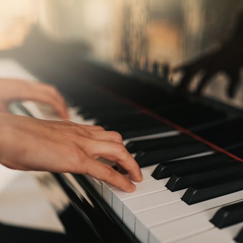 Hands playing piano